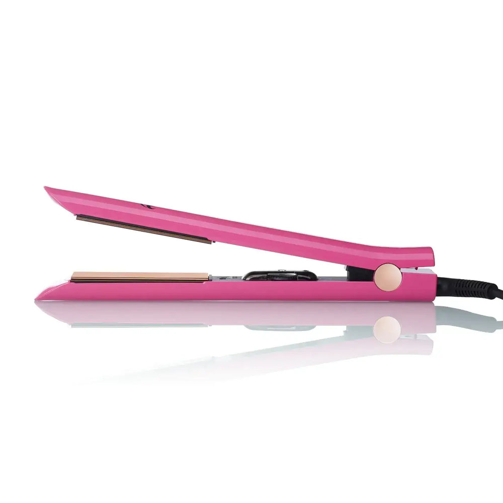 Titanium hair straightener in pink color with floating plates for smooth styling and frizz control.